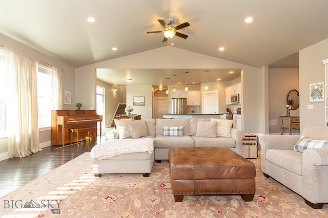 living area with ceiling fan, recessed lighting, vaulted ceiling, wood finished floors, and stairs