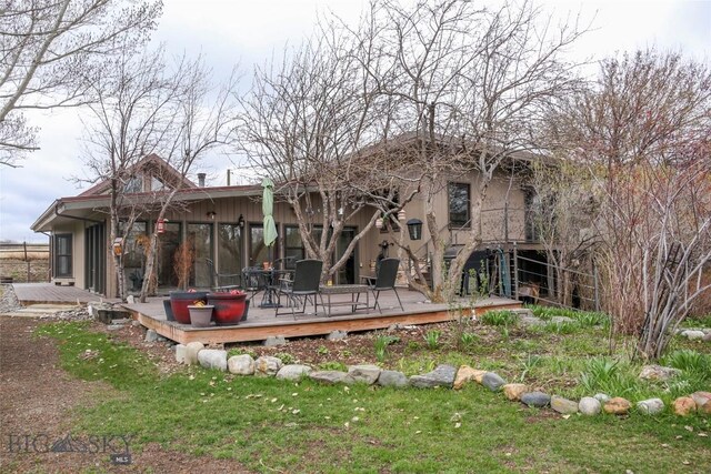 726 US Highway 10 W, Livingston, MT 59047 - back of property featuring a wooden deck and a yard
