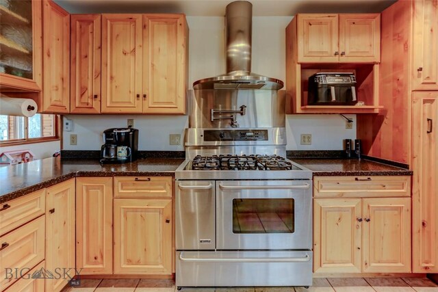 726 US Highway 10 W, Livingston, MT 59047 - kitchen featuring double oven range, wall chimney range hood, light brown cabinetry, and light tile patterned floors