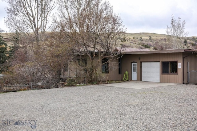 726 US Highway 10 W, Livingston, MT 59047 - ranch-style home featuring driveway, a garage, and metal roof