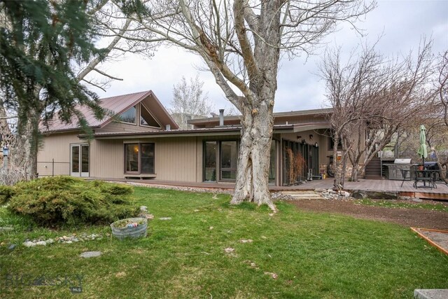 726 US Highway 10 W, Livingston, MT 59047 - back of house featuring a deck, a yard, and metal roof