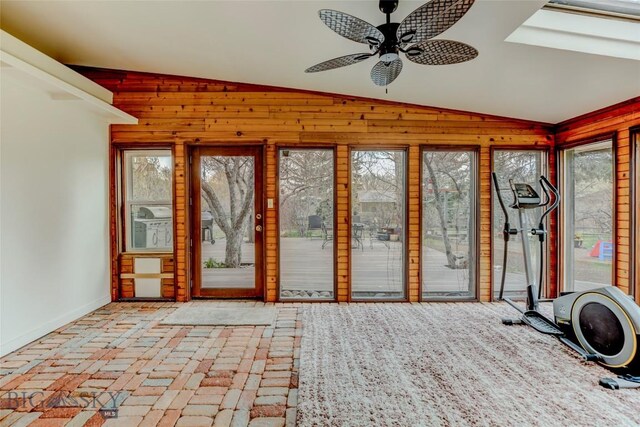726 US Highway 10 W, Livingston, MT 59047 - unfurnished sunroom with lofted ceiling, wooden walls, and baseboards
