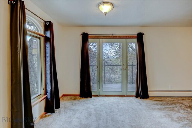 726 US Highway 10 W, Livingston, MT 59047 - spare room featuring a baseboard radiator, carpet floors, plenty of natural light, and baseboards