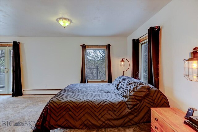 726 US Highway 10 W, Livingston, MT 59047 - bedroom featuring baseboard heating, carpet flooring, and access to exterior