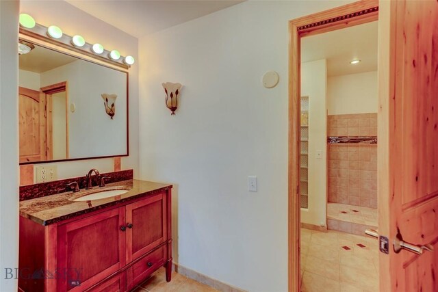 726 US Highway 10 W, Livingston, MT 59047 - bathroom featuring vanity, tile patterned flooring, and a tile shower