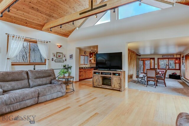 726 US Highway 10 W, Livingston, MT 59047 - living room with track lighting, light wood finished floors, high vaulted ceiling, and wood ceiling with exposed beams