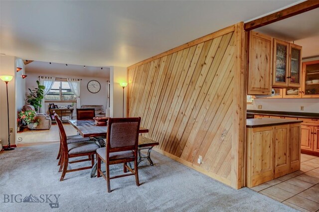 726 US Highway 10 W, Livingston, MT 59047 - dining area featuring wooden walls, baseboards, and light colored carpet