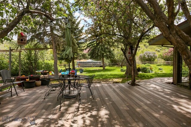 726 US Highway 10 W, Livingston, MT 59047 - wooden deck featuring outdoor dining area