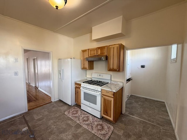 kitchen with under cabinet range hood, light countertops, white appliances, brown cabinetry, and baseboards