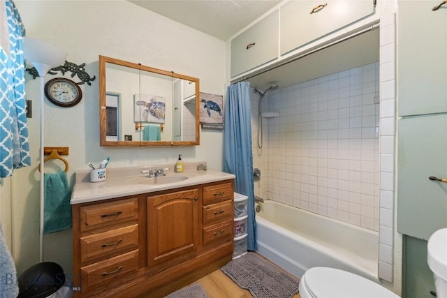 full bath with vanity, toilet, and shower / tub combo