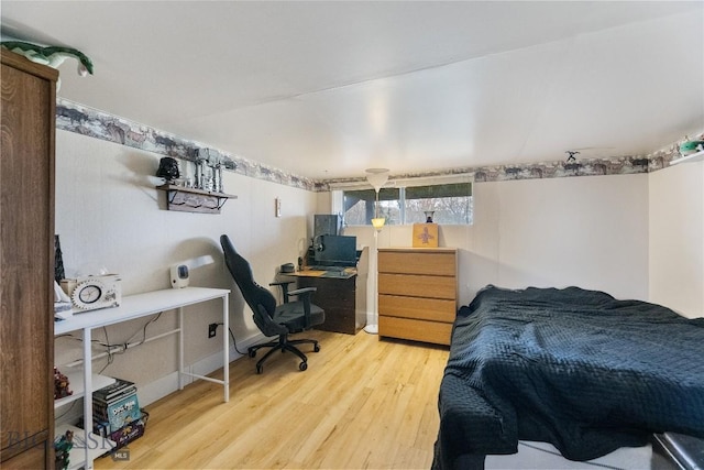 bedroom with wood finished floors