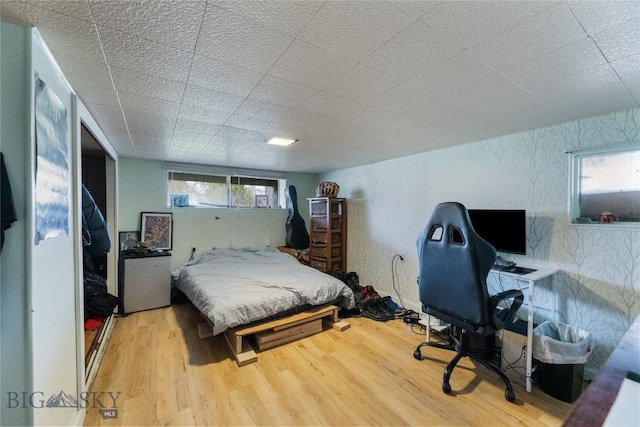 bedroom featuring wood finished floors