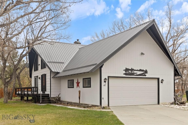 view of front of house with a garage, a wooden deck, a front yard, a chimney, and driveway