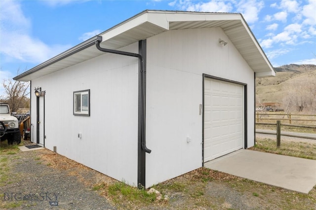 exterior space with fence and a mountain view