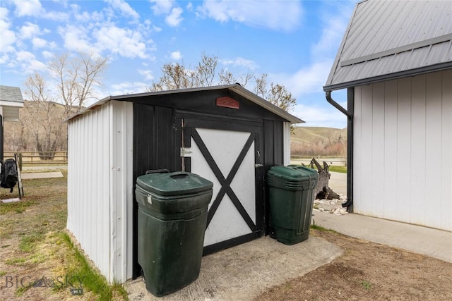 view of shed with fence