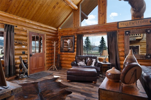 7550 Springhill Rd, Belgrade, MT 59714 - living room featuring wood-type flooring, log walls, a wealth of natural light, and high vaulted ceiling
