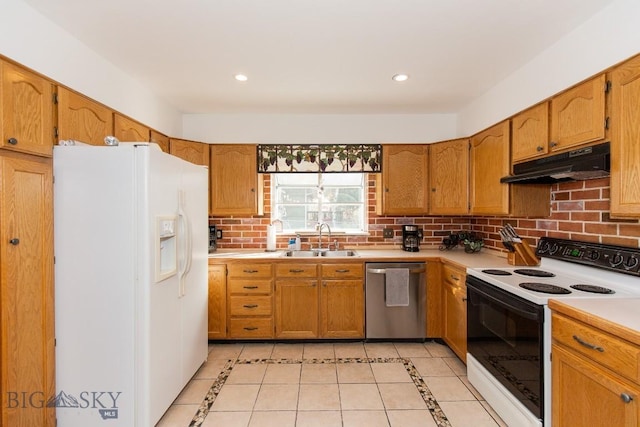 kitchen featuring electric range oven, stainless steel dishwasher, white refrigerator with ice dispenser, a sink, and under cabinet range hood