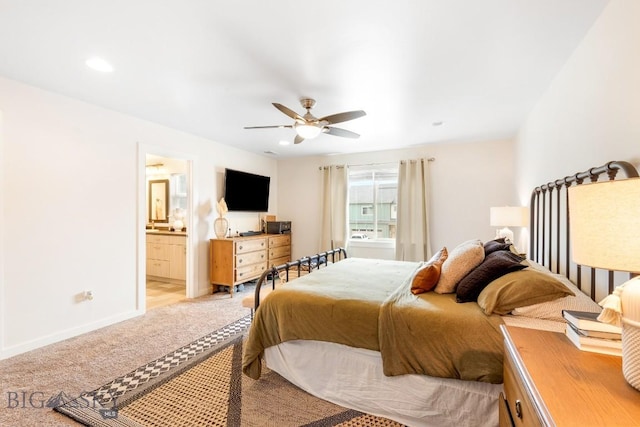 1307 Grover Ln Unit B, Belgrade, MT 59714 - bedroom featuring light colored carpet, baseboards, ceiling fan, and ensuite bathroom