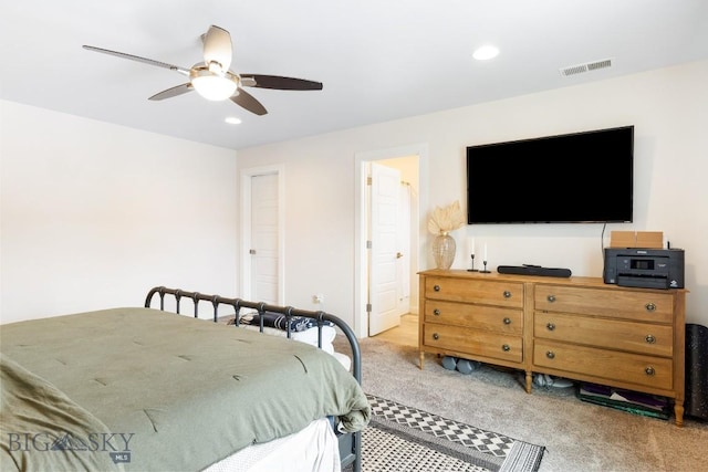 1307 Grover Ln Unit B, Belgrade, MT 59714 - bedroom with ceiling fan, light colored carpet, ensuite bath, recessed lighting, and visible vents