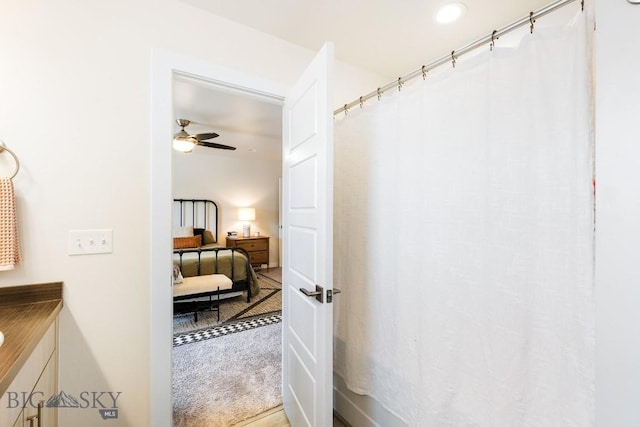 1307 Grover Ln Unit B, Belgrade, MT 59714 - bathroom featuring ceiling fan, curtained shower, and vanity