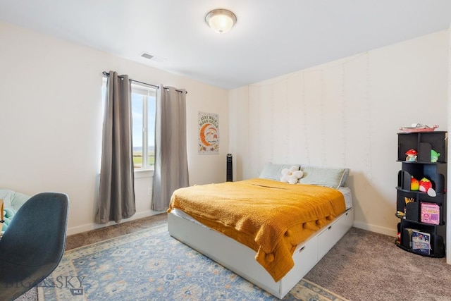 1307 Grover Ln Unit B, Belgrade, MT 59714 - bedroom featuring carpet floors, baseboards, and visible vents