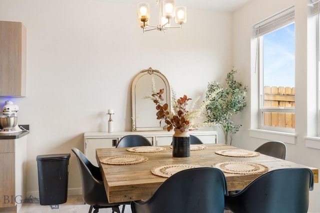 1307 Grover Ln Unit B, Belgrade, MT 59714 - dining space with baseboards and a chandelier