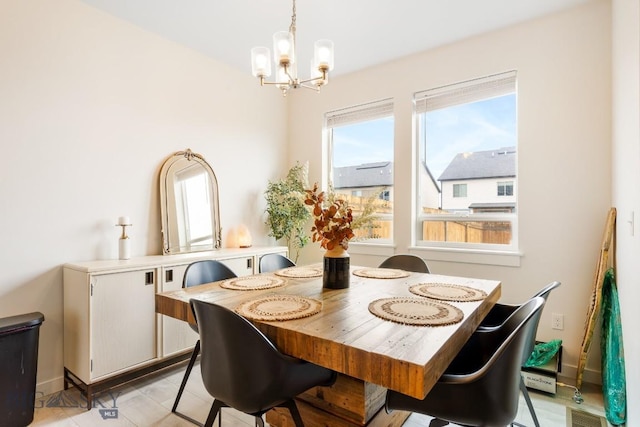 1307 Grover Ln Unit B, Belgrade, MT 59714 - dining space featuring a notable chandelier and visible vents
