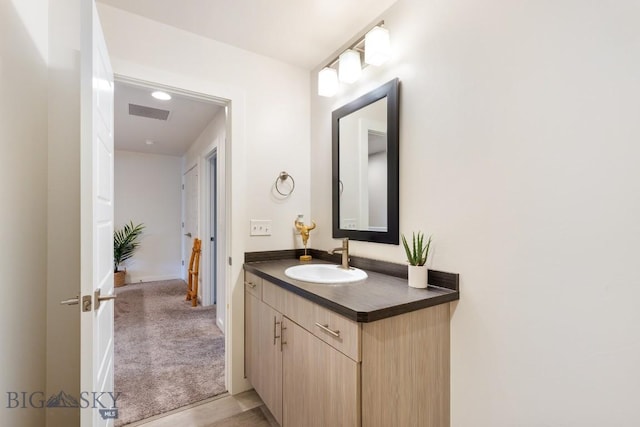 1307 Grover Ln Unit B, Belgrade, MT 59714 - bathroom featuring vanity, baseboards, and visible vents