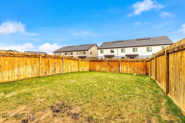 1307 Grover Ln Unit B, Belgrade, MT 59714 - view of yard featuring a residential view and a fenced backyard