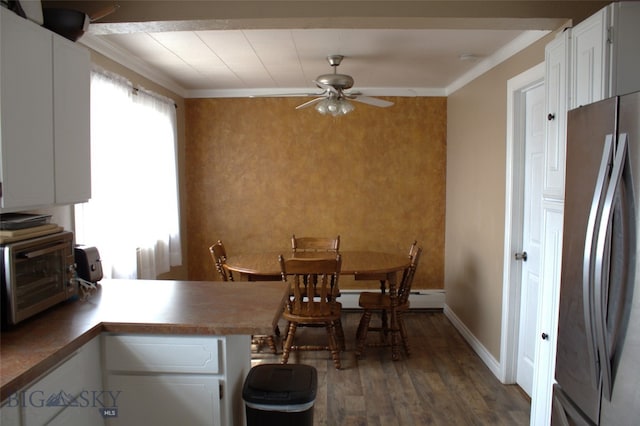 820 Lexington Ave, Butte, MT 59701 - dining room with a toaster, ceiling fan, wood finished floors, and crown molding