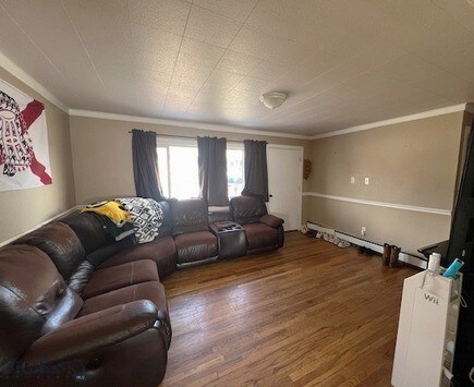 820 Lexington Ave, Butte, MT 59701 - living room with crown molding and wood finished floors