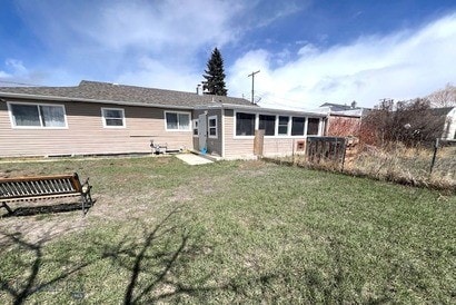 820 Lexington Ave, Butte, MT 59701 - rear view of property featuring fence and a yard