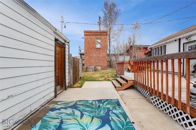 view of patio / terrace featuring fence and a wooden deck