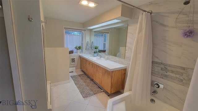 full bathroom with vanity, tile patterned floors, shower / bath combo, and a baseboard heating unit