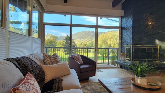 sunroom featuring a mountain view