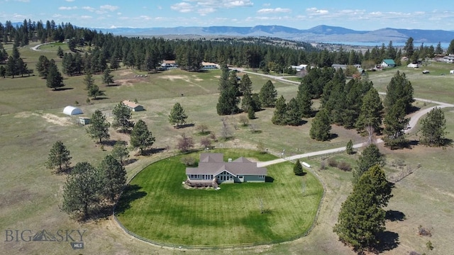 birds eye view of property with a mountain view
