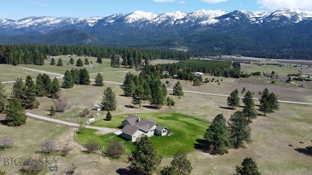 drone / aerial view featuring a mountain view and a rural view