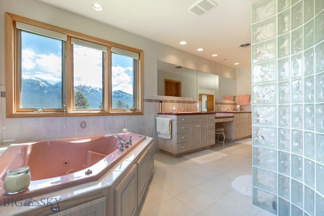 full bathroom featuring visible vents, tile patterned flooring, vanity, a whirlpool tub, and recessed lighting