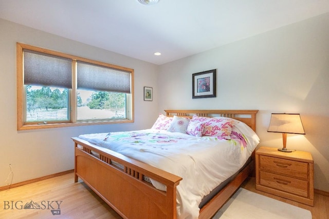 bedroom with recessed lighting, baseboards, and light wood-type flooring