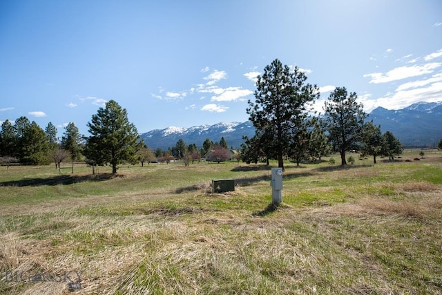 mountain view featuring a rural view