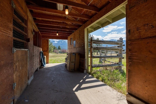 view of horse barn featuring a mountain view