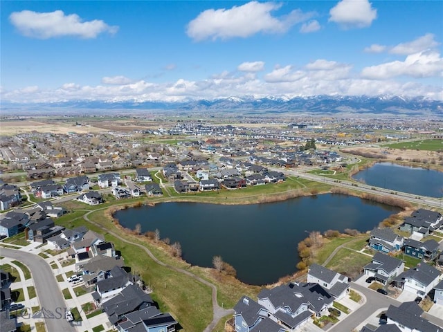aerial view featuring a water and mountain view and a residential view