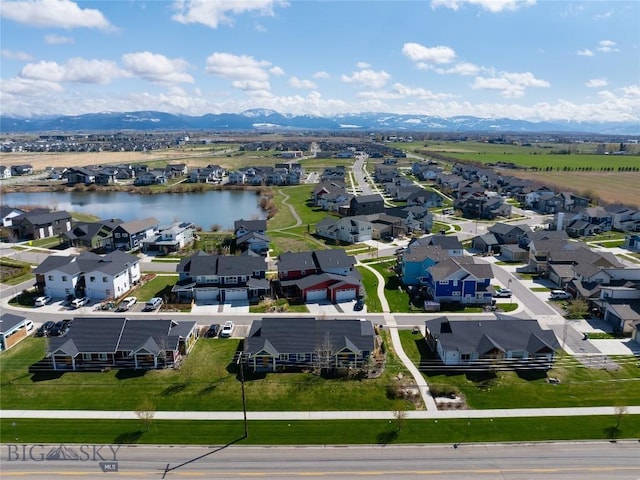 birds eye view of property with a residential view and a water and mountain view