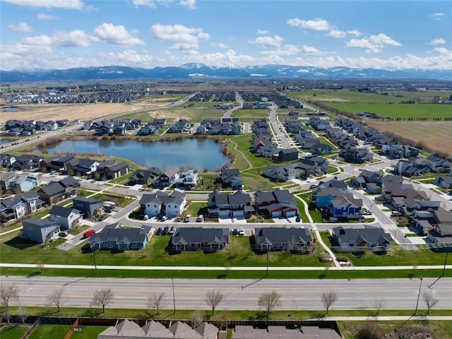 aerial view featuring a residential view and a water and mountain view