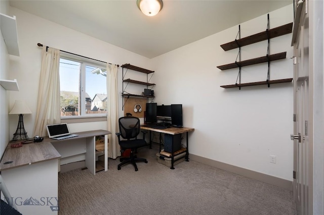 office with baseboards and carpet