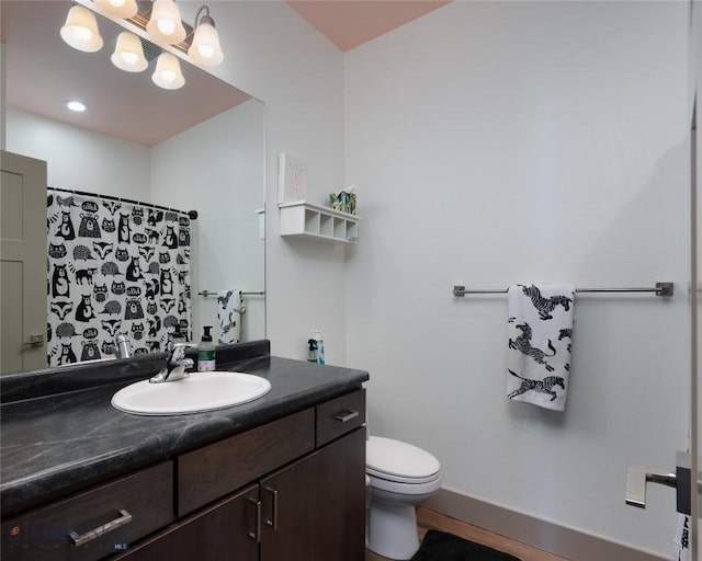 full bathroom with vanity, baseboards, toilet, and a shower with shower curtain