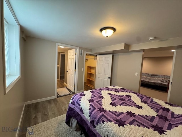 216 W 2nd Ave, Big Timber, MT 59011 - bedroom with baseboards, wood finished floors, visible vents, and a closet