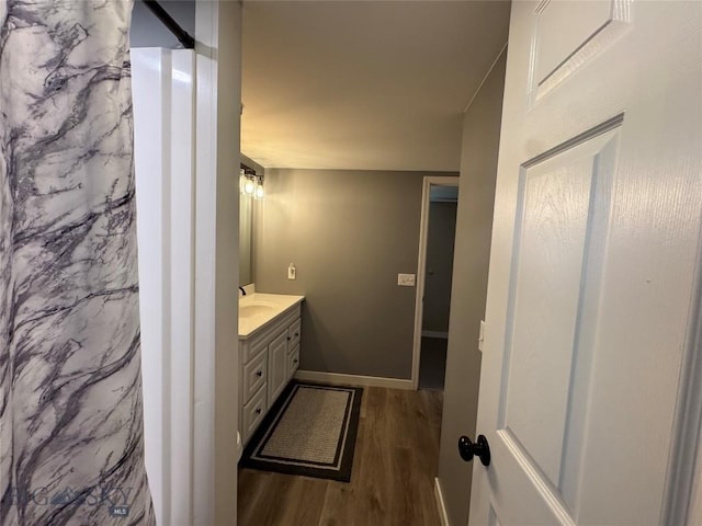 216 W 2nd Ave, Big Timber, MT 59011 - bathroom with vanity, baseboards, and wood finished floors