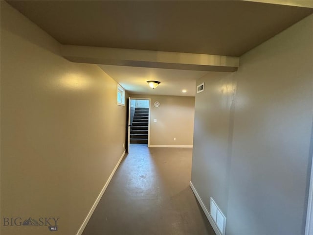 216 W 2nd Ave, Big Timber, MT 59011 - hall featuring visible vents, concrete floors, baseboards, and stairway