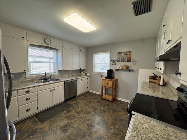 216 W 2nd Ave, Big Timber, MT 59011 - kitchen featuring visible vents, a sink, baseboards, light countertops, and stainless steel appliances